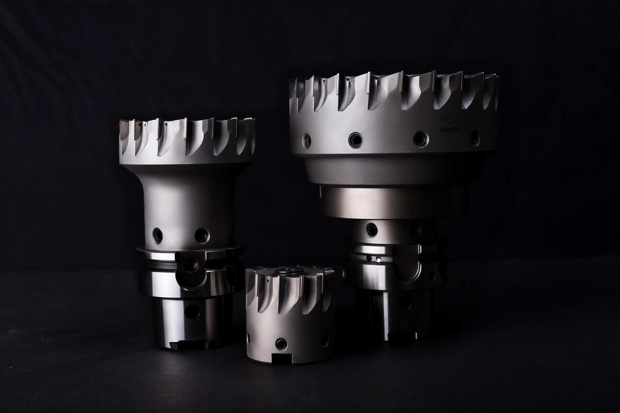 Three face milling cutters from the FaceMill-Diamond series against a black background. 