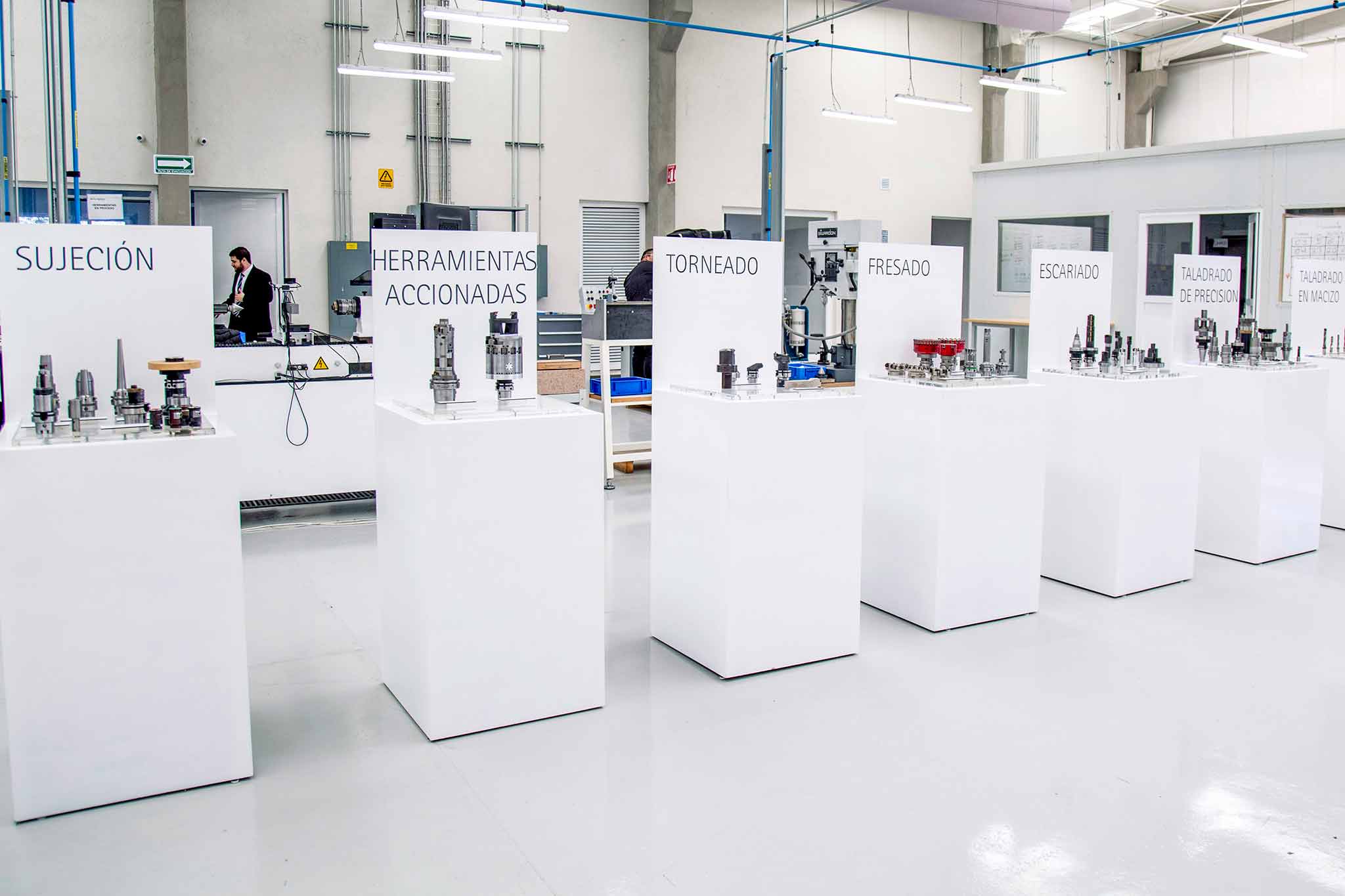 Various product areas are displayed on steles in the machine hall with sample tools.