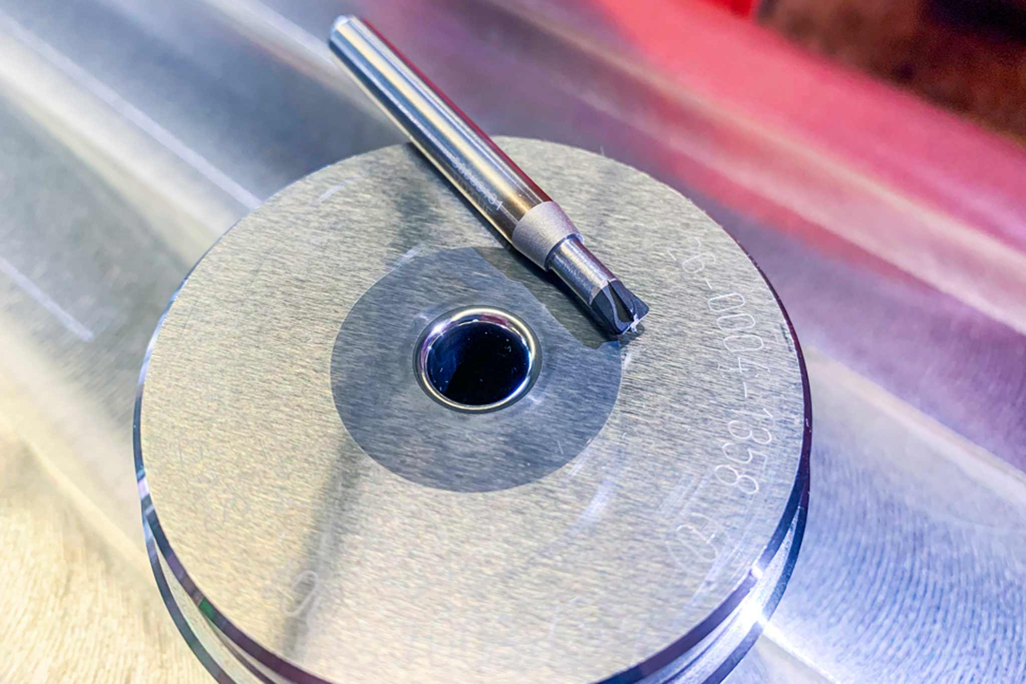 A PCD full-head milling cutter from MAPAL lies on a die.