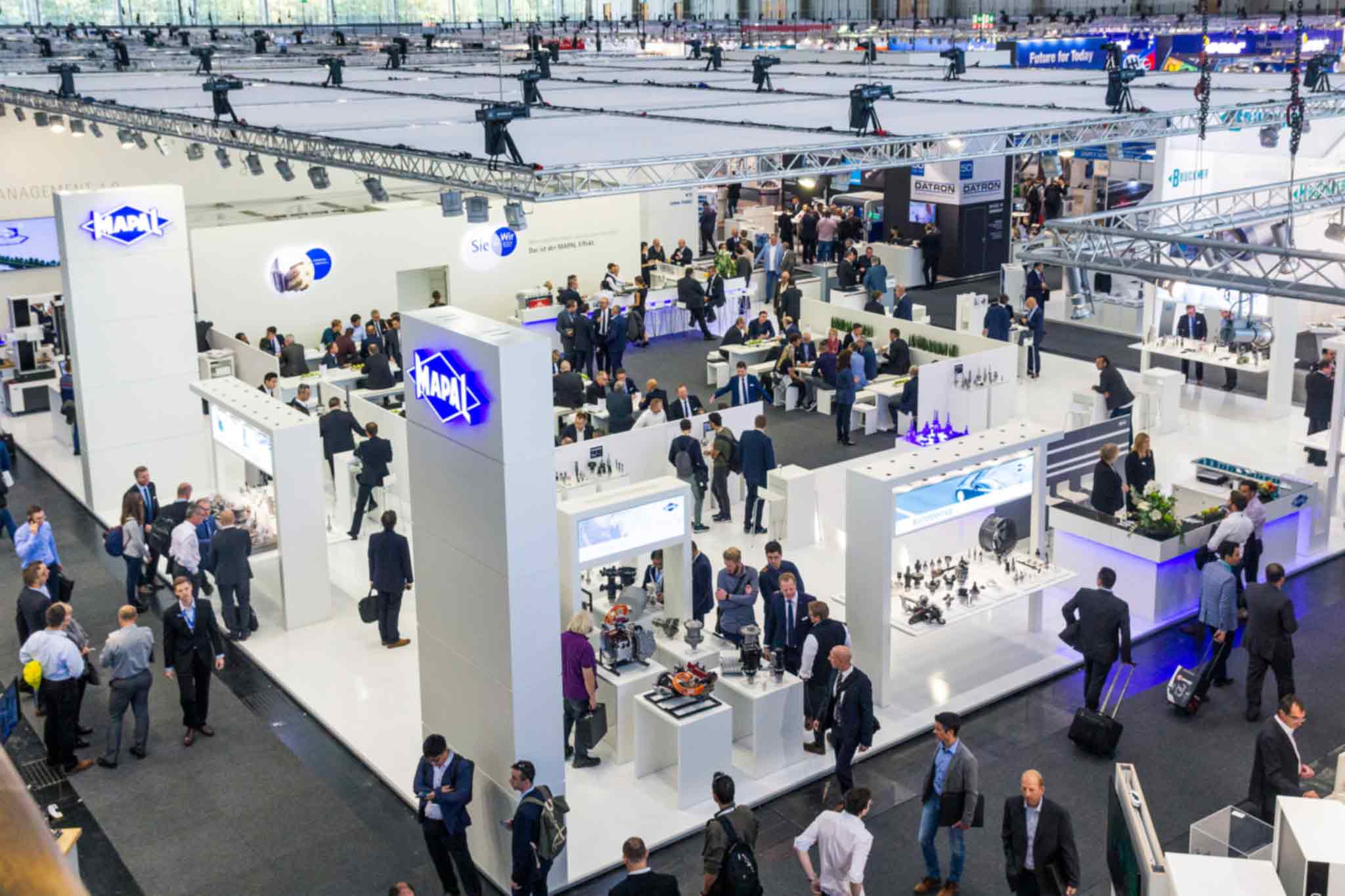 The busy MAPAL stand at EMO 2019 is shown diagonally from above.