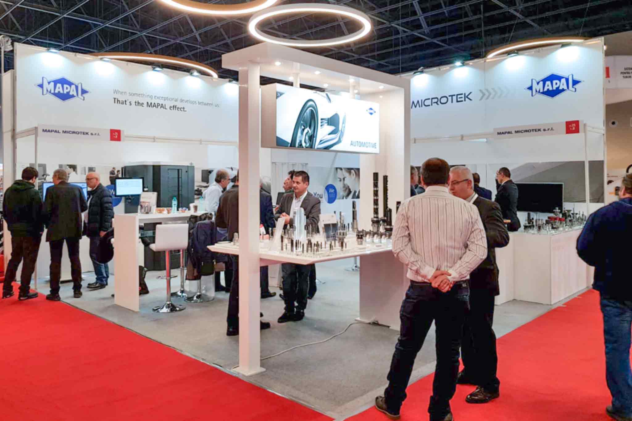 The MAPAL Microtek S.R.L. exhibition stand at Metalshow 2019 in Bucharest, Romania, attended by visitors and employees.